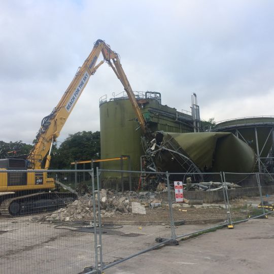 Machine performing a site demolition