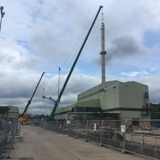 Ron Hull cranes over an industrial site demolition