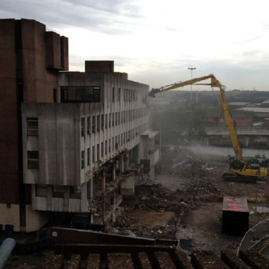 Concrete building being demolished