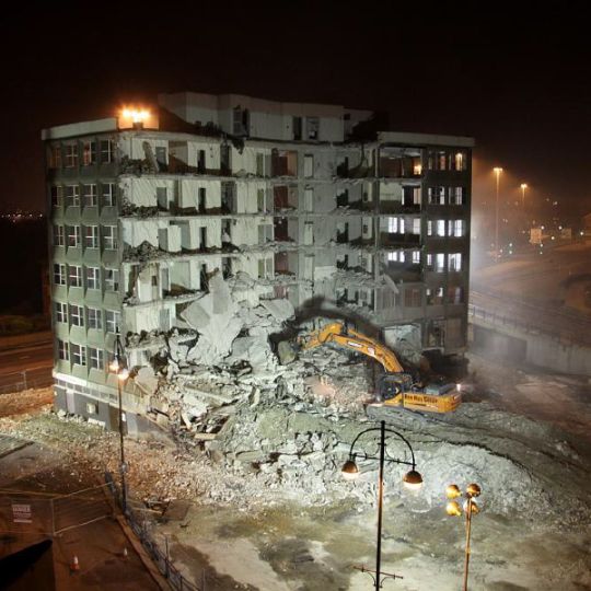 Building demolition underway by Ron Hull Ltd at night