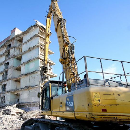 Tall building being demolished