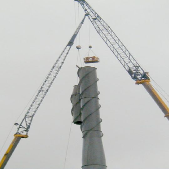 Industrial chimney being prepped for demolition