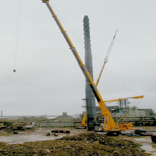 Industrial chimney being prepared for demolition