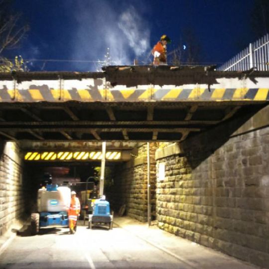 Bridge being demolished at night