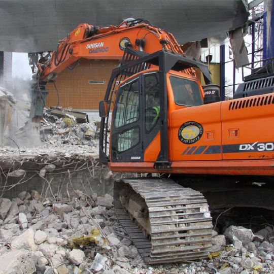 Sports centre being demolished by digger