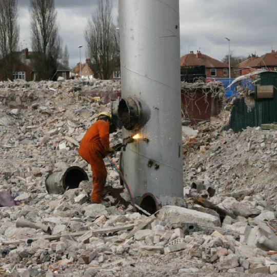 Metal vent being cut apart during demolition