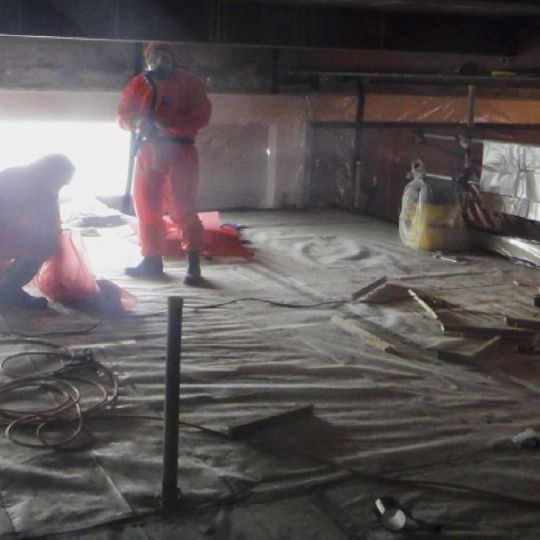 Staff in protective clothing during building decontamination