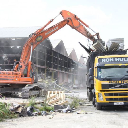 Demolition waste being loading into a truck