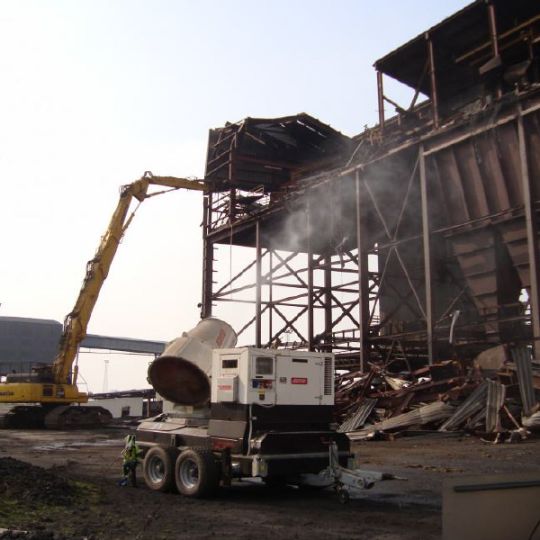 Steel building frame being demolished