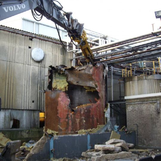 Industrial equipment being demolished