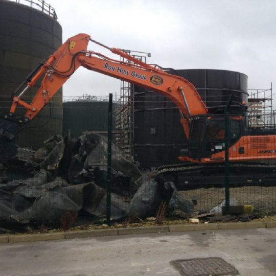 Ron Hull machine working on demolition